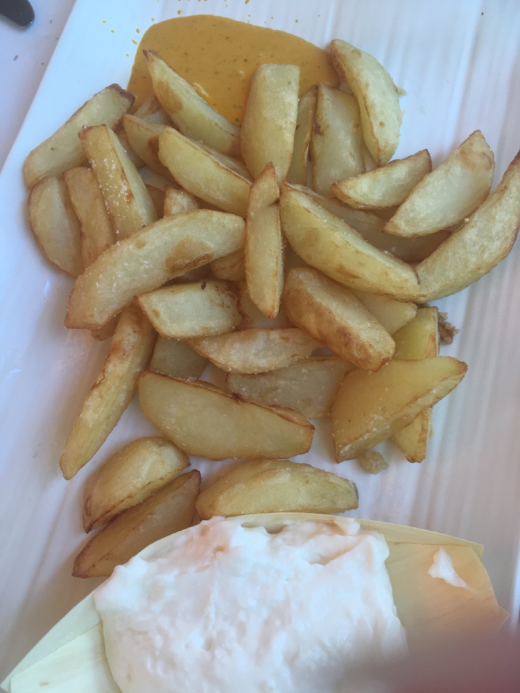French fries and alioli― garlicy mayonaise.&nbsp;