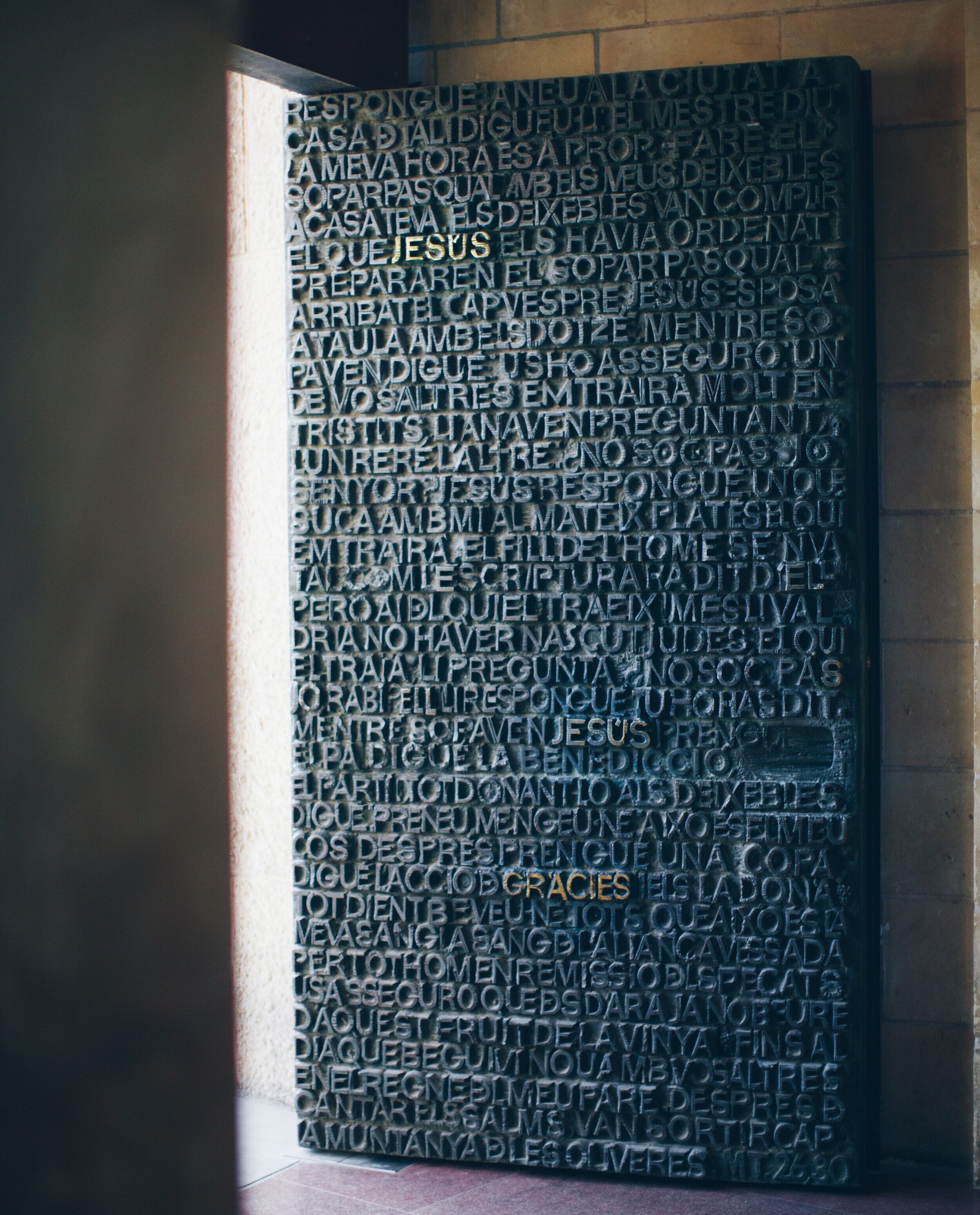 A door in Catalan at the Sagrada Familia in Barcelona, one of the most famous cathedrals in Spain. Photo by Jenny Marvin on Unsplash