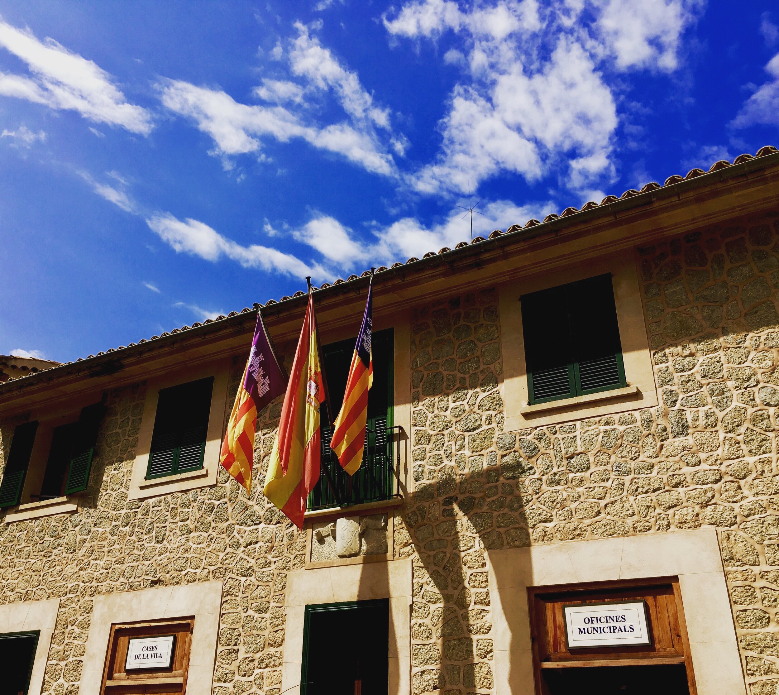 The flags shown on a building in Mallorca, where you will find a dialect of Catalan.