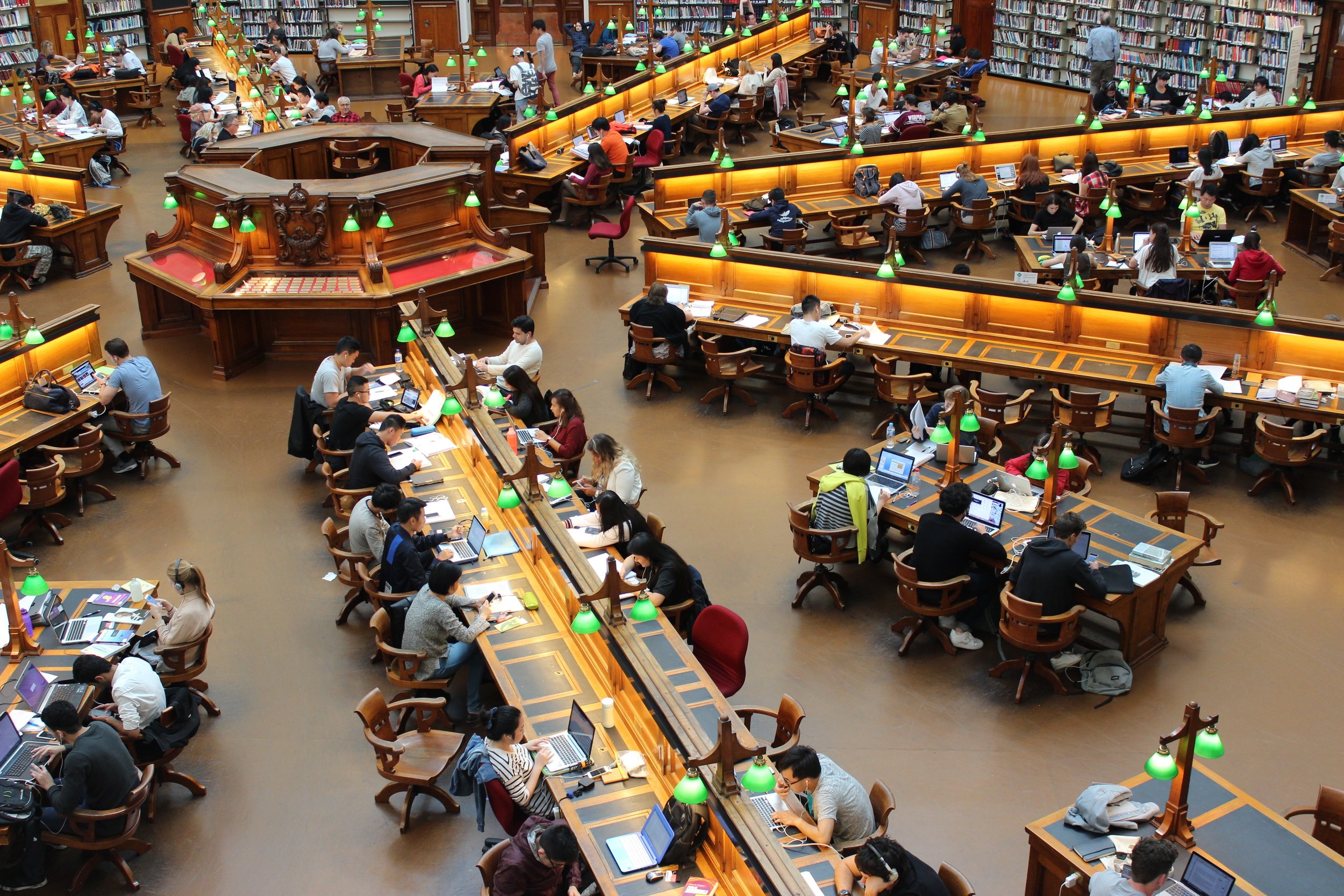 Library full of people. Photo by Pixabay on Pexels.