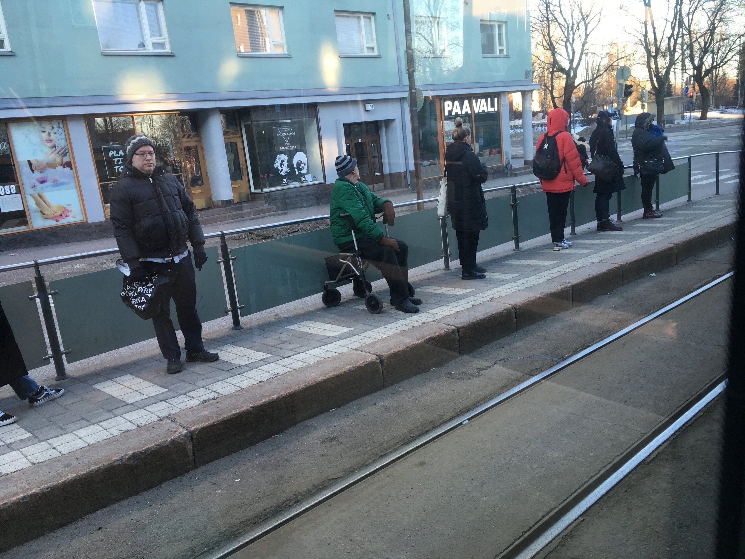 Watching people waiting for the tram in Helsinki is nothing like people waiting for the bus in Granada.