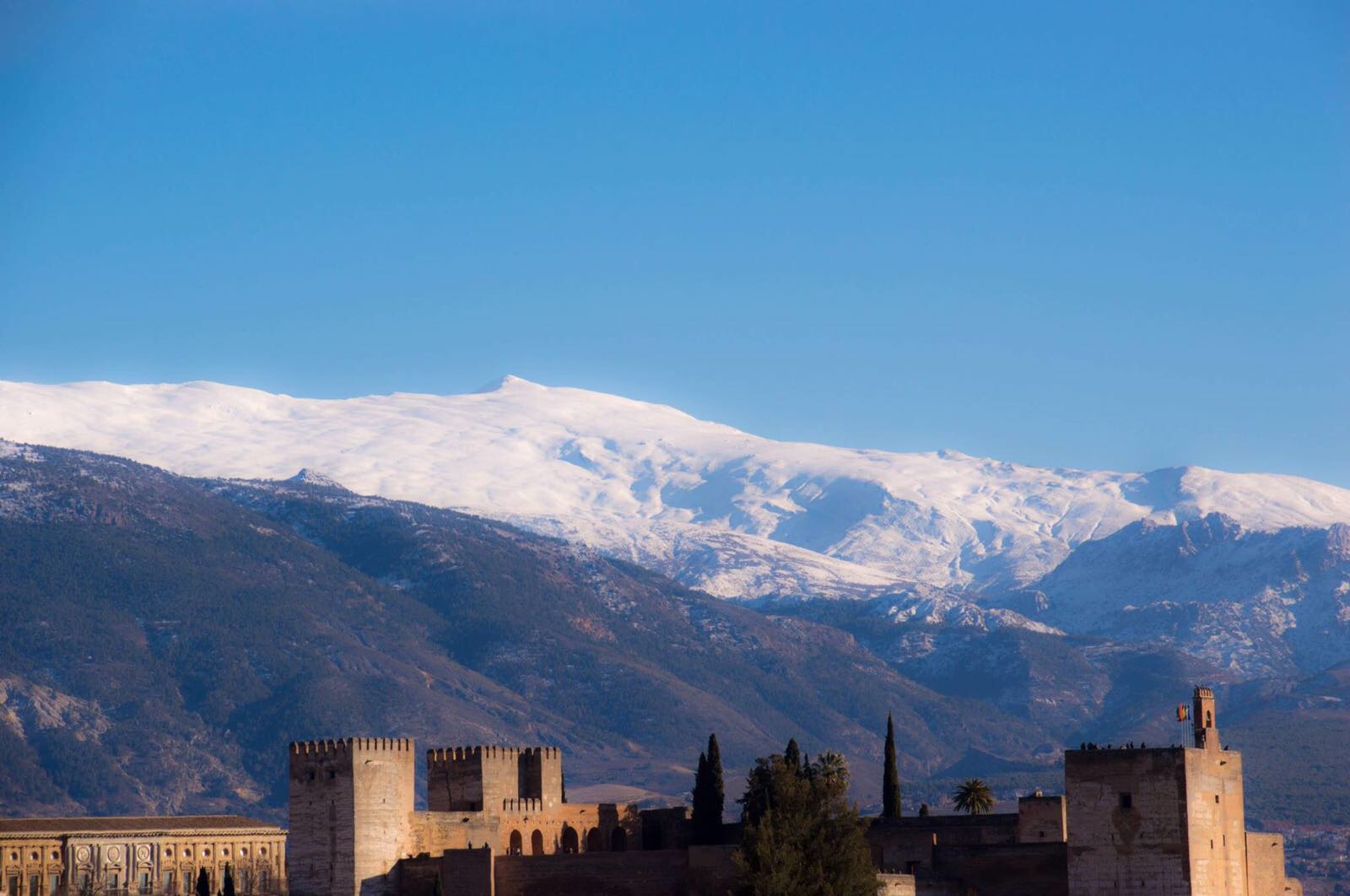 The Alhambra with the Sierra Nevada in the background. Granada. Photo by Edoardo Massai