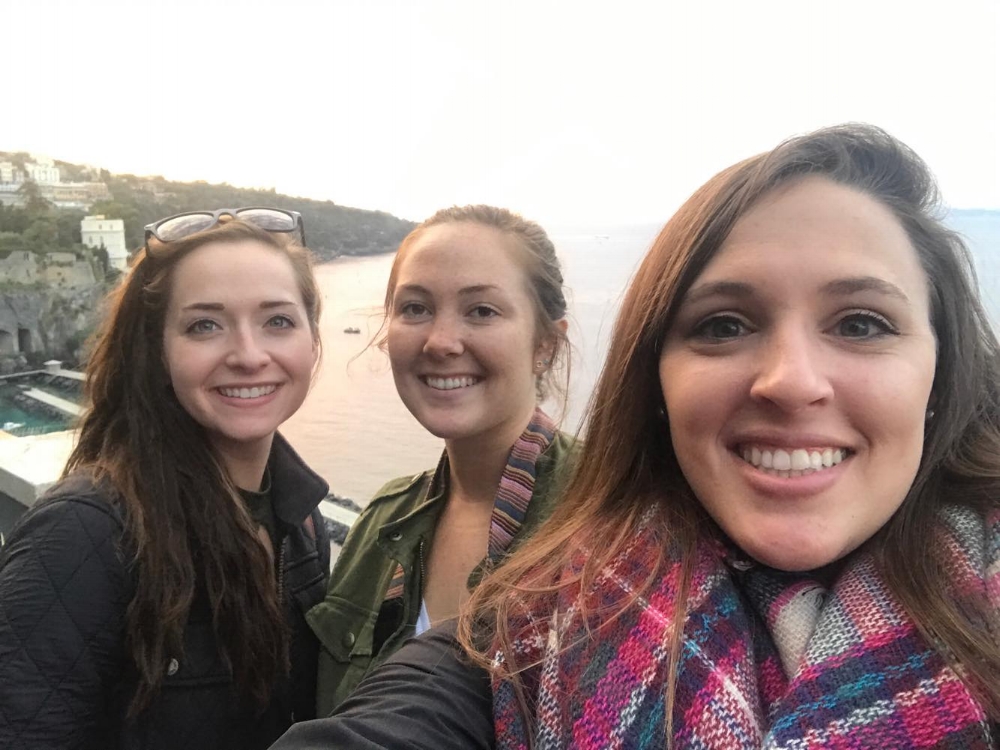 Lexa and Caroline in Italy with a friend for the sunset.